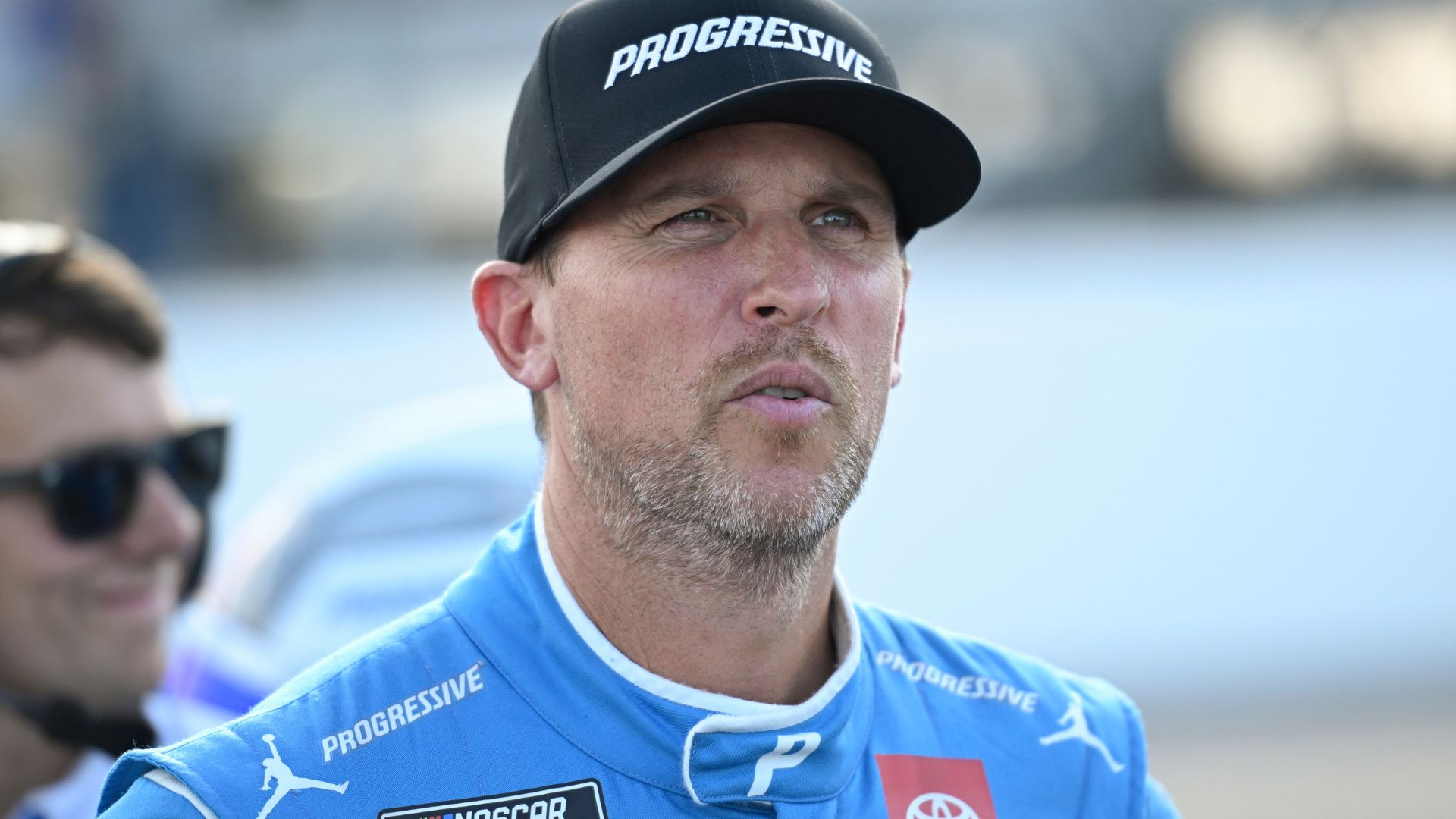 Sep 6, 2025; Madison, Illinois, USA; NASCAR Cup Series driver Denny Hamlin (11) looks on during practice and qualifying for the Enjoy Illinois 300 at World Wide Technology Raceway