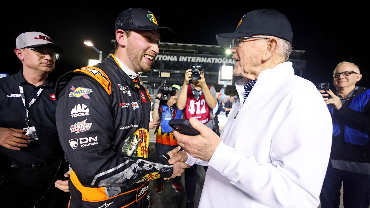 NASCAR Cup Series driver Chase Briscoe (19) celebrates with team owner Joe Gibbs after winning the pole during qualifying for the Daytona 500 at Daytona International Speedway.