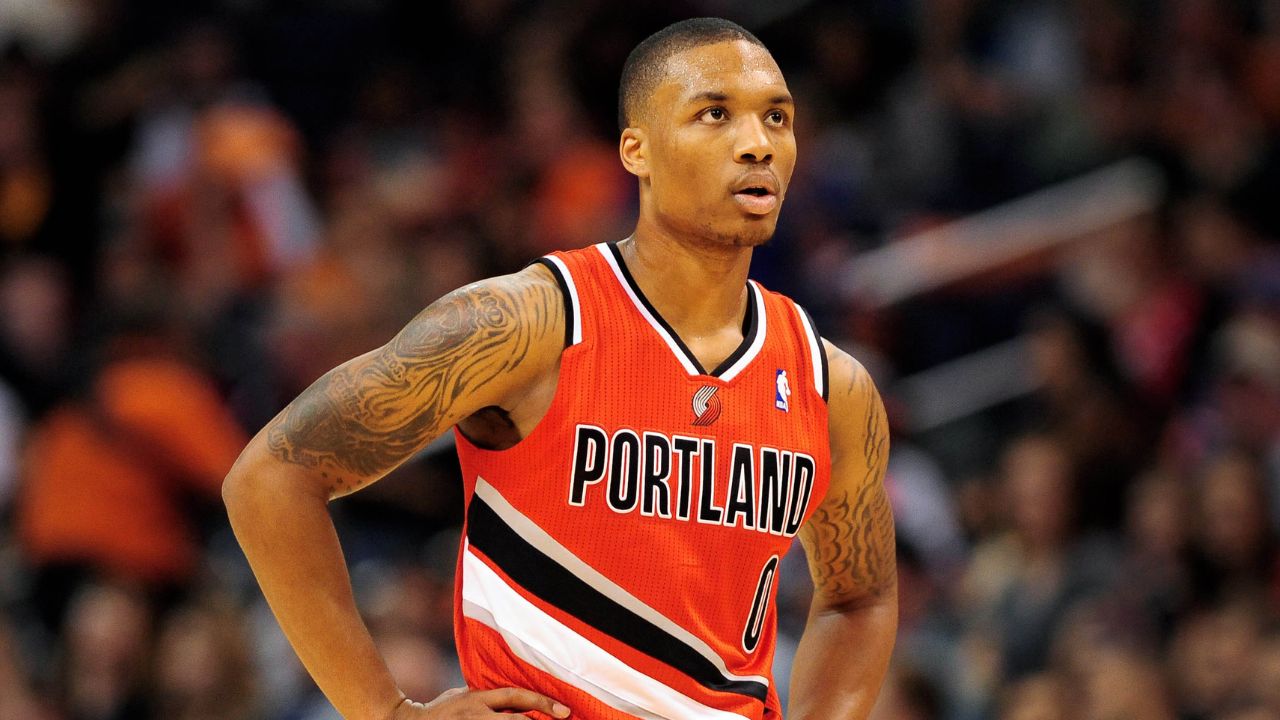 Portland Trail Blazers guard Damian Lillard (0) stands on the court during the game against the Phoenix Suns in the first half at US Airways Center.