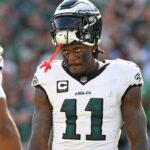 Philadelphia Eagles wide receiver AJ. Brown (11) and running back Saquon Barkley (26) during the fourth quarter against the Los Angeles Rams at Lincoln Financial Field.