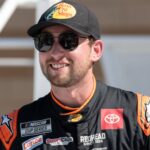 Sep 27, 2025; Kansas City, Kansas, USA; Chase Briscoe celebrates winning the starting pole position for the NASCAR Cup Series race at Kansas Speedway