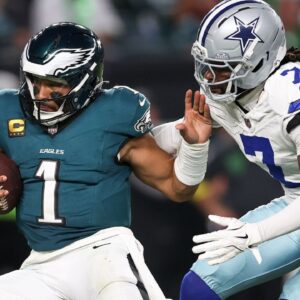 Dallas Cowboys cornerback Trevon Diggs (7) tackles Philadelphia Eagles quarterback Jalen Hurts (1) during the third quarter of the game at Lincoln Financial Field.
