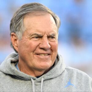 North Carolina Tar Heels head coach Bill Belichick with a recruit before the game at Kenan Stadium.