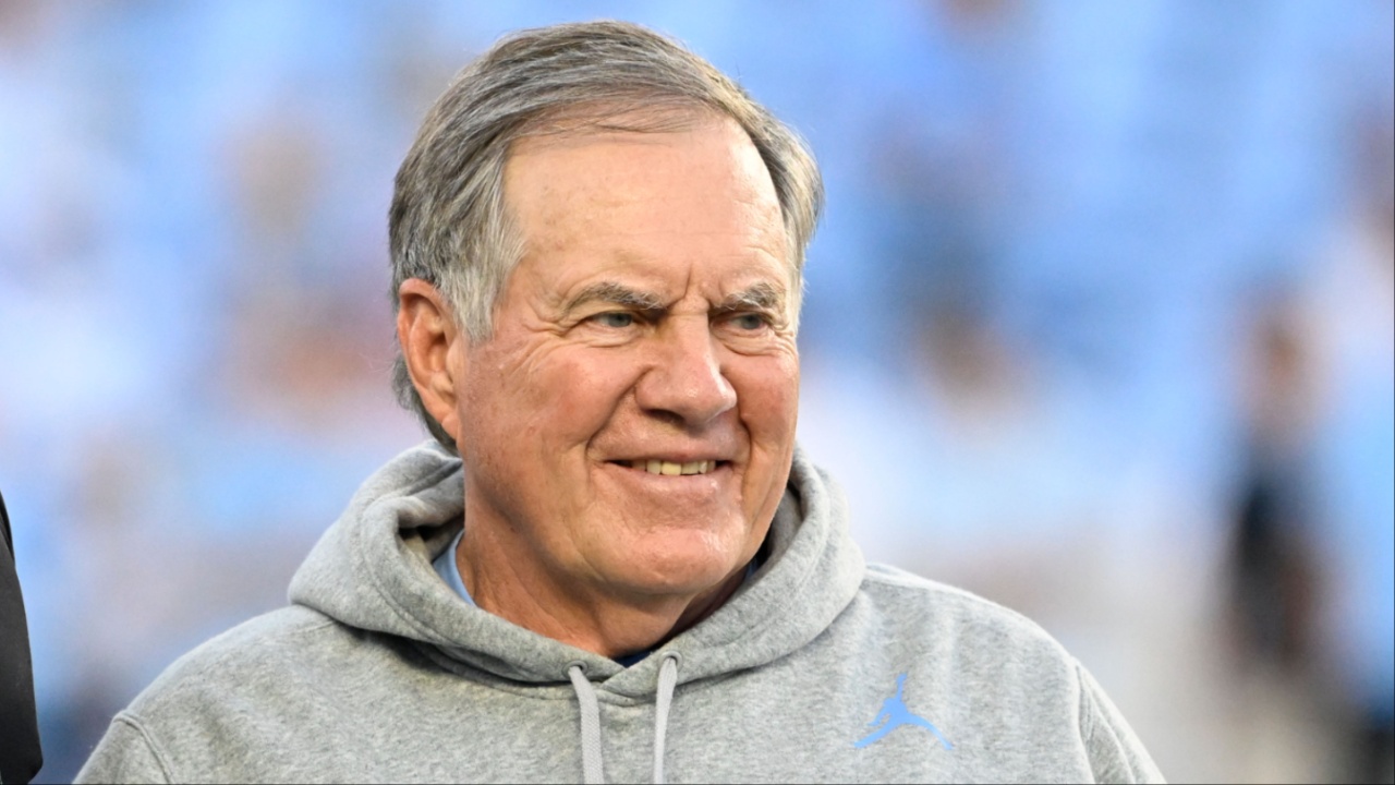 North Carolina Tar Heels head coach Bill Belichick with a recruit before the game at Kenan Stadium.