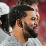 Chicago Bears quarterback Caleb Williams (18) on the sidelines against the Kansas City Chiefs during the second half of the game at GEHA Field at Arrowhead Stadium.