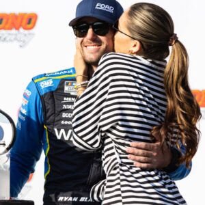 Ryan Blaney (12) gets a kiss from fiancé Gianna Tulio after winning the NASCAR Cup Series on July 14, 2024