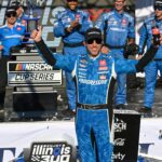 NASCAR Cup Series driver Denny Hamlin (11) poses for a photo after winning the Enjoy Illinois 300 at World Wide Technology Raceway.