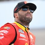 Sep 6, 2025; Madison, Illinois, USA; NASCAR Cup Series driver Bubba Wallace (23) looks on during practice and qualifying for the Enjoy Illinois 300 at World Wide Technology Raceway.