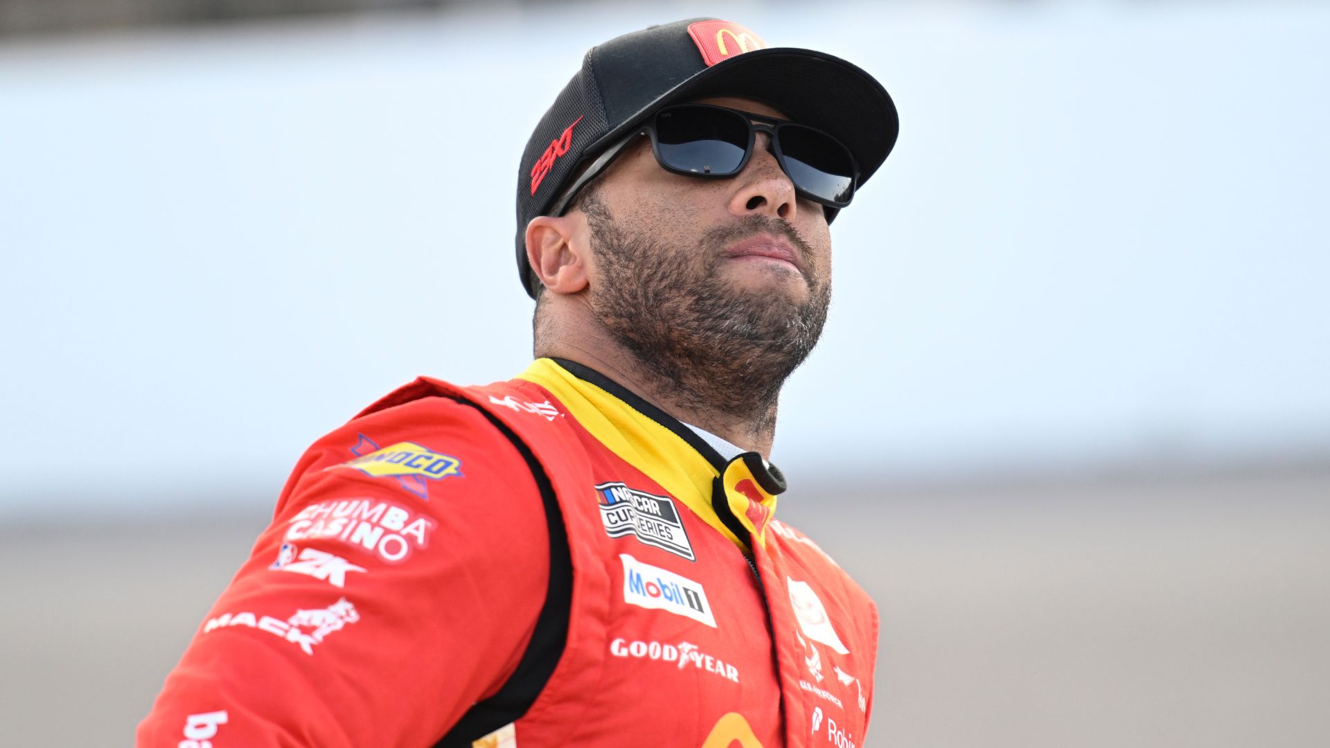 Sep 6, 2025; Madison, Illinois, USA; NASCAR Cup Series driver Bubba Wallace (23) looks on during practice and qualifying for the Enjoy Illinois 300 at World Wide Technology Raceway.
