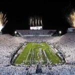 Fireworks burst overhead as the Penn State Nittany Lions take the field prior to a White Out game against the Washington Huskies at Beaver Stadium.