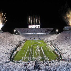 Fireworks burst overhead as the Penn State Nittany Lions take the field prior to a White Out game against the Washington Huskies at Beaver Stadium.