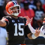 Cleveland Browns quarterback Joe Flacco (15) is chased through the end zone by Cincinnati Bengals defensive end Trey Hendrickson (91) in the fourth quarter of the NFL Week 1 game between the Cleveland Browns and the Cincinnati Bengals at Huntington Bank Field in Cleveland on Sunday, Sept. 7, 2025. The Bengals begin the season with a 17-16 win over the Browns.