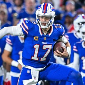 Buffalo Bills quarterback Josh Allen (17) carries the ball in the fourth quarter against the Miami Dolphins at Highmark Stadium.