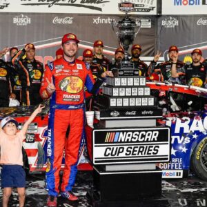 NASCAR Cup Series driver Chase Briscoe (19) celebrates his win with his son Brooks at the Cook Out Southern 500 at Darlington Raceway.