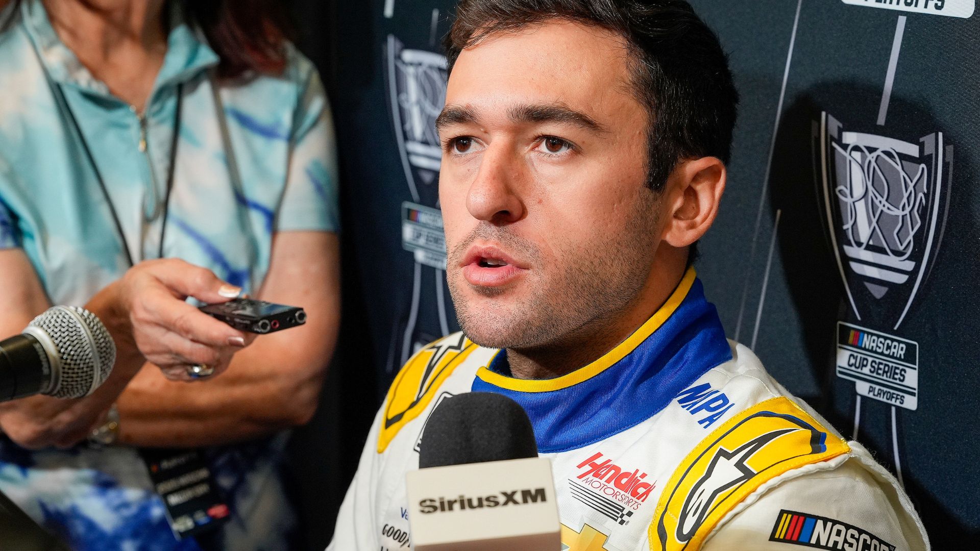 Aug 27, 2025; Charlotte, NC, USA; Chase Elliott answers questions from the media during NASCAR Cup Series Playoff Media Day at Charlotte Convention Center.