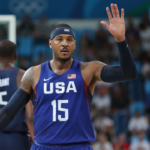 USA forward Carmelo Anthony (15) high fives teammates against Sweden during the men's basketball semifinal match