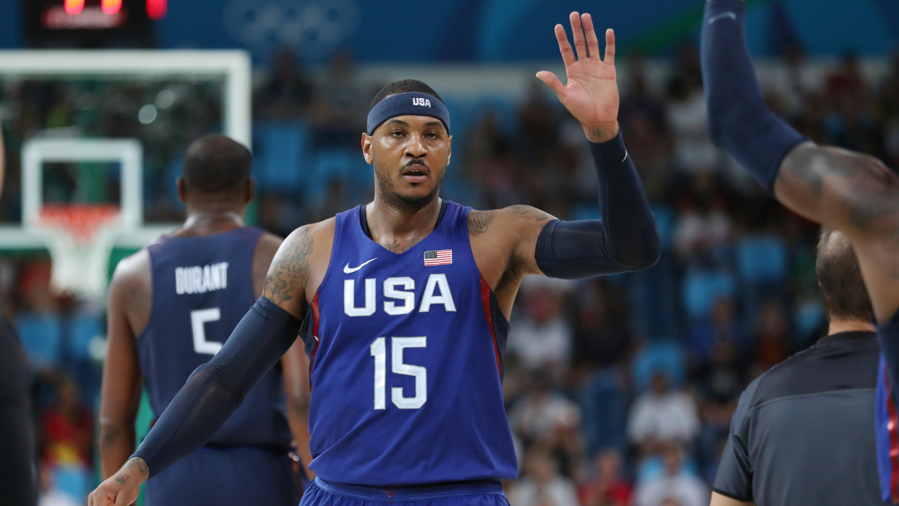 USA forward Carmelo Anthony (15) high fives teammates against Sweden during the men's basketball semifinal match