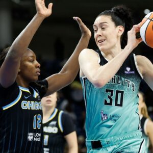 Sep 11, 2025; Chicago, Illinois, USA; New York Liberty forward Breanna Stewart (30) drives to the basket against Chicago Sky forward Michaela Onyenwere (12) during the first half at Wintrust Arena.