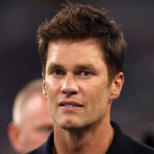 Former NFL player Tom Brady on the field before the game between the Dallas Cowboys and the Las Vegas Raiders at AT&T Stadium.