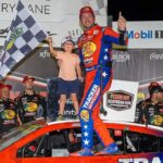 NASCAR Cup Series driver Chase Briscoe (19) and his son Brooks celebrates his win at the Cook Out Southern 500 at Darlington Raceway.