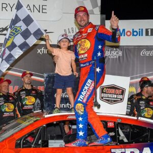 NASCAR Cup Series driver Chase Briscoe (19) and his son Brooks celebrates his win at the Cook Out Southern 500 at Darlington Raceway.