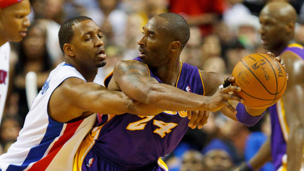 Nov 17, 2010; Auburn Hills, MI, USA; Los Angeles Lakers shooting guard Kobe Bryant (24) is defended by Detroit Pistons shooting guard Tracy McGrady (1) during the game at The Palace. The Lakers defeated the Pistons 103-90. Mandatory Credit: Rick Osentoski-Imagn Images