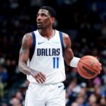 Feb 27, 2025; Dallas, Texas, USA; Dallas Mavericks guard Kyrie Irving (11) controls the ball against the Charlotte Hornets during the second half at American Airlines Center.