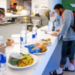 Ohio State Buckeyes defensive tackle Michael Bennett eats lunch in the cafeteria during training at EXOS gym in preparation for the NFL combine and draft.