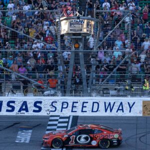 Sep 29, 2024; Kansas City, Kansas, USA; NASCAR Cup Series driver Ross Chastain (1) crosses the finish line to win the Hollywood Casino 400 at Kansas Speedway.