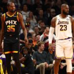 Los Angeles Lakers forward LeBron James (23) against Phoenix Suns forward Kevin Durant (35) during an NBA Cup game at Footprint Center.