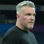 Pat McAfee watches workouts at the 2025 NFL Scouting Combine at Lucas Oil Stadium.
