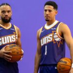 Phoenix Suns forward Dillon Brooks (3) and guard Devin Booker (1) pose for portrait during Media Day at PHX Arena.
