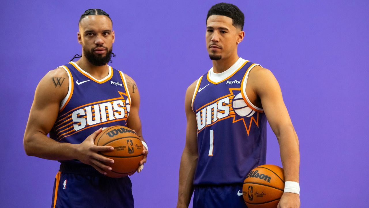 Phoenix Suns forward Dillon Brooks (3) and guard Devin Booker (1) pose for portrait during Media Day at PHX Arena.