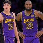 Jan 17, 2025; Los Angeles, California, USA; Los Angeles Lakers guard Austin Reaves (15) and forward LeBron James (23) talk on the court against the Brooklyn Nets at Crypto.com Arena.