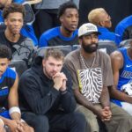 Dallas Mavericks Luka Doncic 77 and Kyrie Irving 11 watch from the bench during an NBA, Basketball