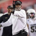 Colorado Buffaloes head coach Deion Sanders reacts after a play during the third quarter against the Houston Cougars at TDECU Stadium.