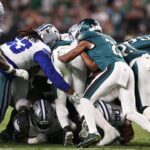 The Philadelphia Eagles execute a tush push for a first down against the Dallas Cowboys during the fourth quarter of the game at Lincoln Financial Field.