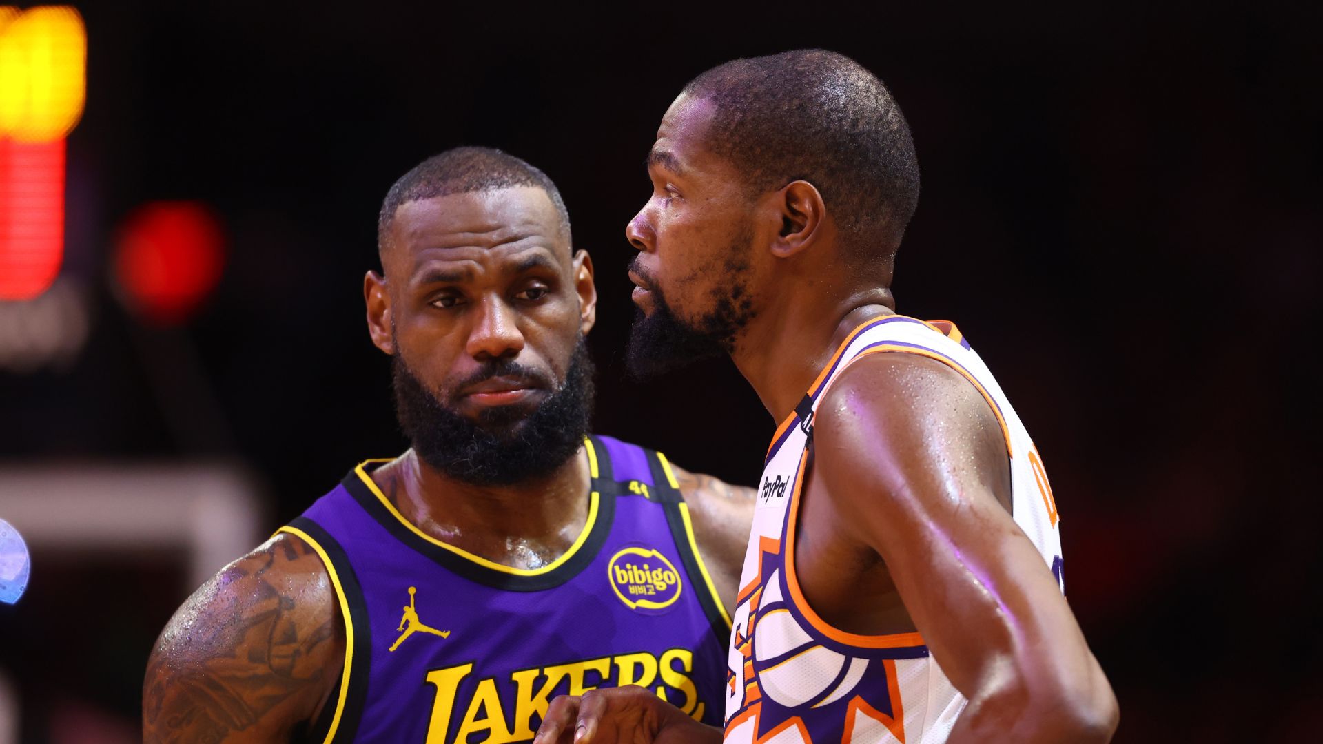Oct 28, 2024; Phoenix, Arizona, USA; Los Angeles Lakers forward LeBron James (23) against Phoenix Suns forward Kevin Durant (35) at Footprint Center