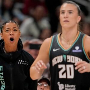 New York Liberty's Natasha Cloud (9) cheers on New York Liberty's Sabrina Ionescu (20) as she competes Friday, July 18, 2025, during the WNBA All-Star 3-point contest at Gainbridge Fieldhouse in Indianapolis.