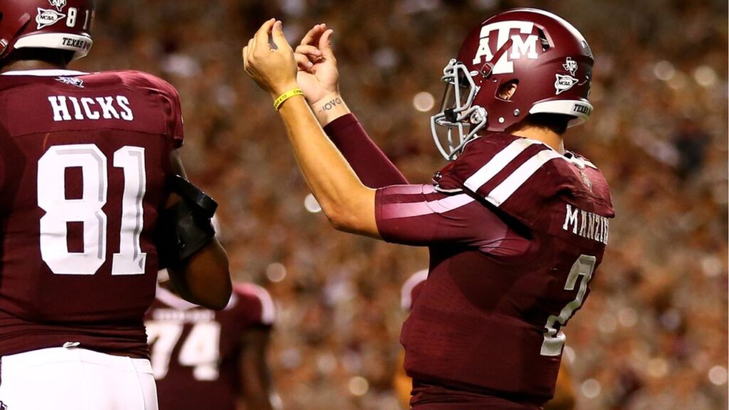 Texas A&M Aggies quarterback Johnny Manziel (2) gestures with his fingers as he celebrates a third quarter touchdown against the SMU Mustangs at Kyle Field.
