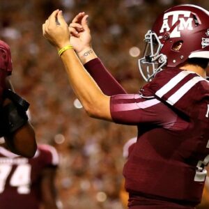 Texas A&M Aggies quarterback Johnny Manziel (2) gestures with his fingers as he celebrates a third quarter touchdown against the SMU Mustangs at Kyle Field.