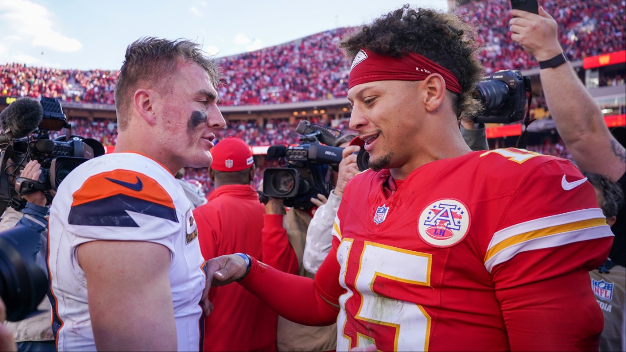 Denver Broncos quarterback Bo Nix (10) talks with Kansas City Chiefs quarterback Patrick Mahomes (15) after the game at GEHA Field at Arrowhead Stadium.