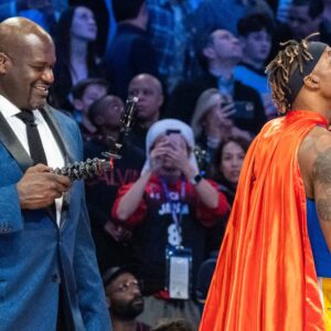 February 15, 2020; Chicago, Illinois, USA; NBA great Shaquille O'Neal (left) videotapes Los Angeles Lakers player Dwight Howard (right) in a Superman costume dedicated to the late Los Angeles Lakers great Kobe Bryant during NBA All Star Saturday Night at United Center.