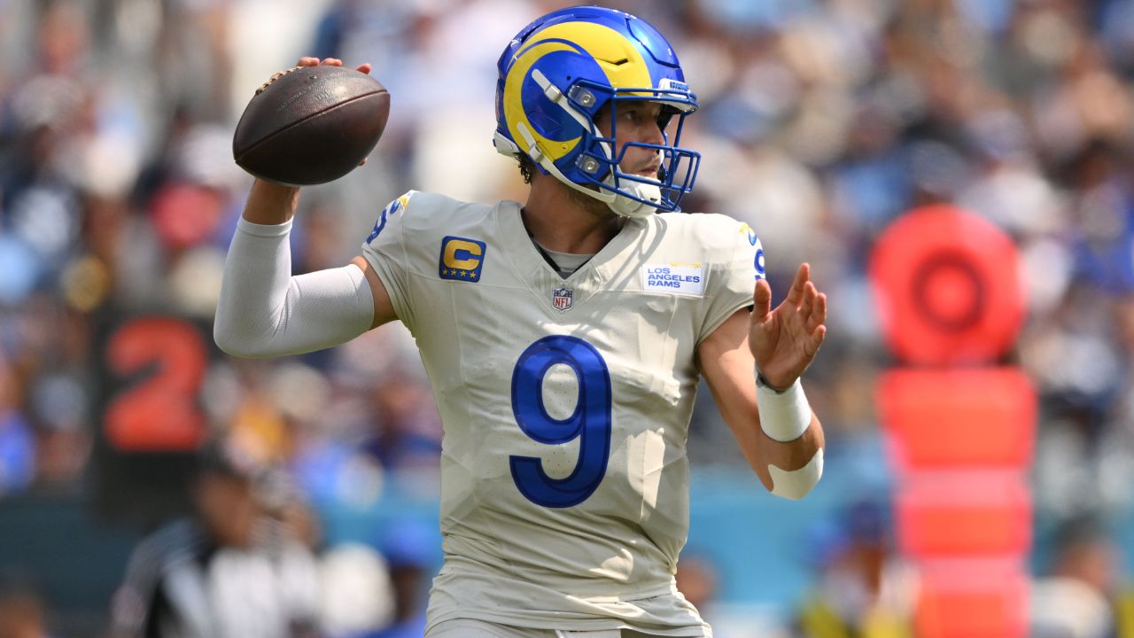 Sep 14, 2025; Nashville, Tennessee, USA; Los Angeles Rams quarterback Matthew Stafford (9) drops back to pass Tennessee Titans during the first half at Nissan Stadium.