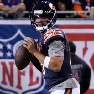 Chicago Bears quarterback Caleb Williams (18) drops back to pass against the Minnesota Vikings during the first half at Soldier Field.