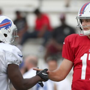 Bills quarterback Josh Allen and running back LeSean McCoy, share a custom handshake during training camp at St. John Fisher College. Jg 073019 Bills 3