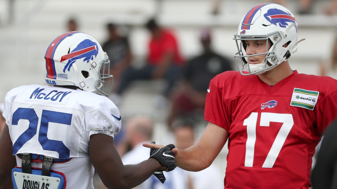 Bills quarterback Josh Allen and running back LeSean McCoy, share a custom handshake during training camp at St. John Fisher College. Jg 073019 Bills 3