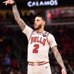Chicago Bulls forward Lonzo Ball (2) hits a three point shot against Toronto Raptors guard Jamal Shead (23) during overtime at the United Center.