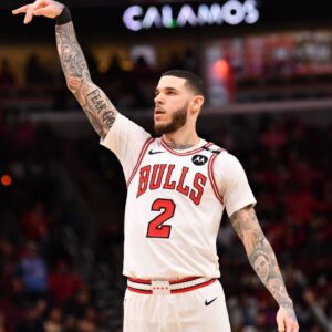 Chicago Bulls forward Lonzo Ball (2) hits a three point shot against Toronto Raptors guard Jamal Shead (23) during overtime at the United Center.