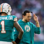 Miami Dolphins head coach Mike McDaniel talks to quarterback Tua Tagovailoa (1) against the Dallas Cowboys during the second quarter at Hard Rock Stadium.